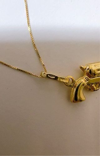 Collana con pendente pistola in oro 18kt 750