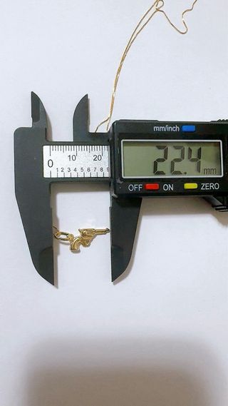 Collana con pendente pistola in oro 18kt 750