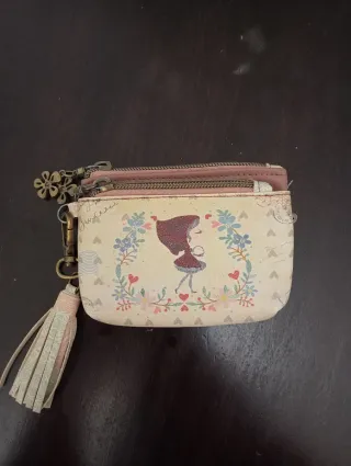 Monedero con borla y charm