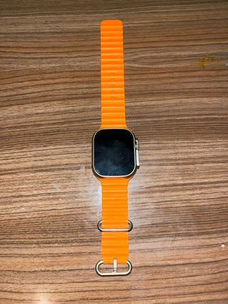 Smartwatch stile Ultra + cinturino arancione + caricatore