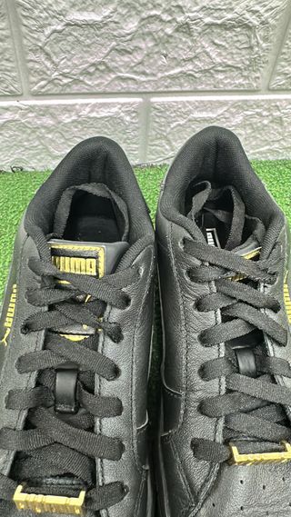 Scarpe Puma nere e oro