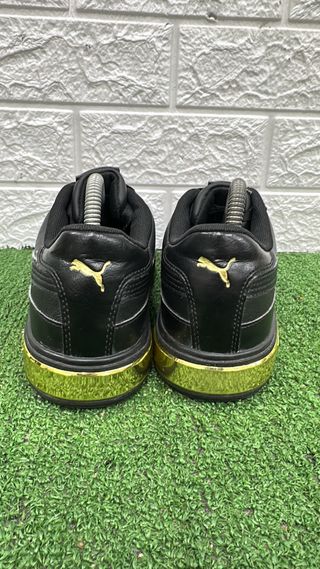 Scarpe Puma nere e oro