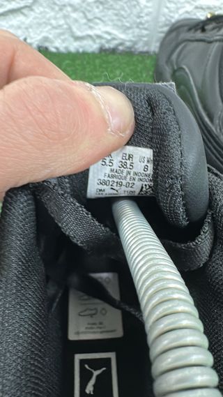 Scarpe Puma nere e oro