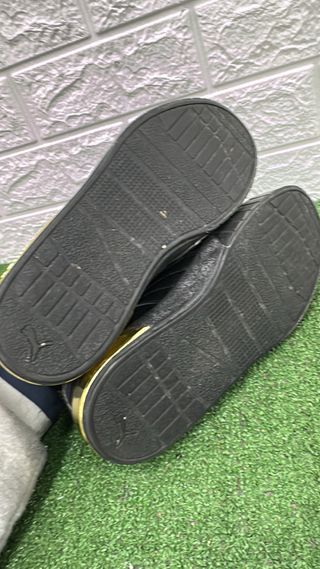 Scarpe Puma nere e oro