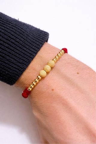 Bracciale corda rossa con sfere oro 18kt 750