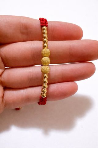 Bracciale corda rossa con sfere oro 18kt 750