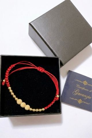 Bracciale corda rossa con sfere oro 18kt 750