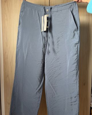 Pantalones Zara fluidos botones y cordón