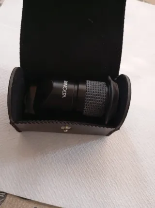 Funda Minolta con lente objetivo