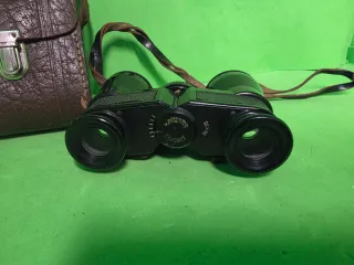 Prismáticos antiguos con funda