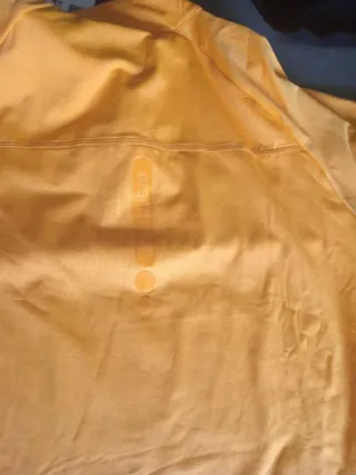 Conjunto deportivo Arena negro y naranja