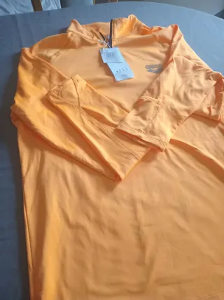 Conjunto deportivo Arena negro y naranja