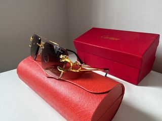 Gafas de sol Cartier doradas y grises