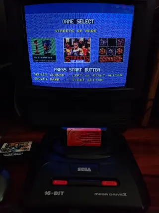 Sega Mega Drive II con giochi e cavi