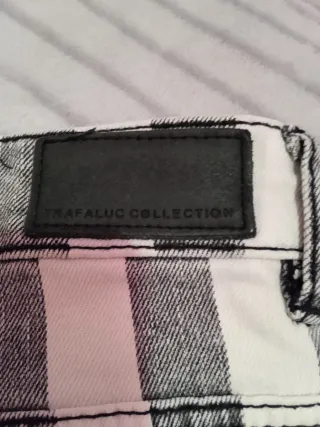 Pantalones Trafaluc rayas grises y blancas