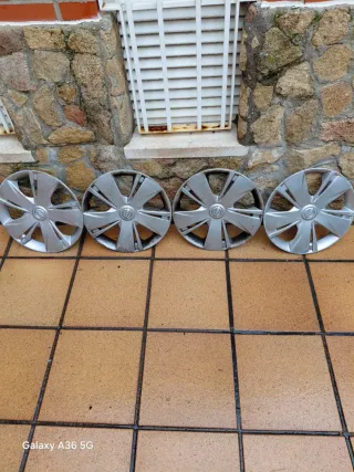 Juego 4 Tapacubos Nissan Micra 14