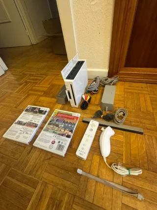 Nintendo Wii con 1 controller, 2 giochi e altri componenti