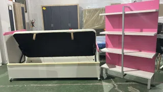 Cama convertible rosa y blanca