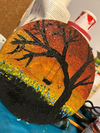 Cuadro redondo atardecer con columpio Guitarra...