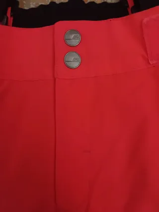 Pantaloni sci arancioni con bretelle