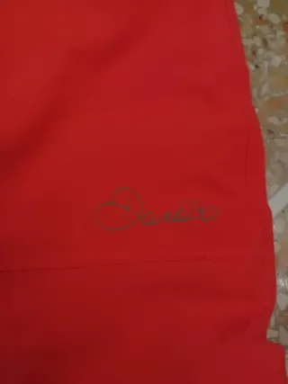 Pantaloni sci arancioni con bretelle