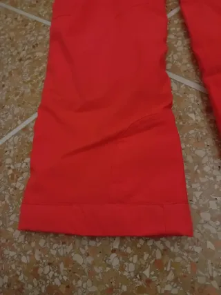 Pantaloni sci arancioni con bretelle