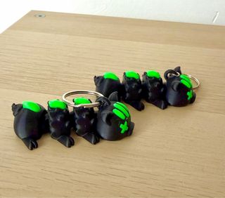 Portachiavi maialino punk nero e verde