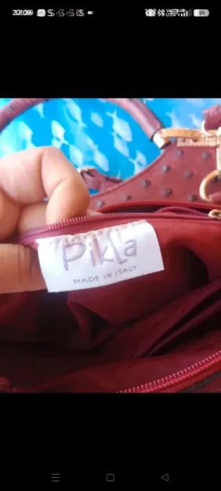 Borsa donna in pelle rossa con dettagli oro