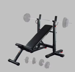 Banco musculación y barra con discos