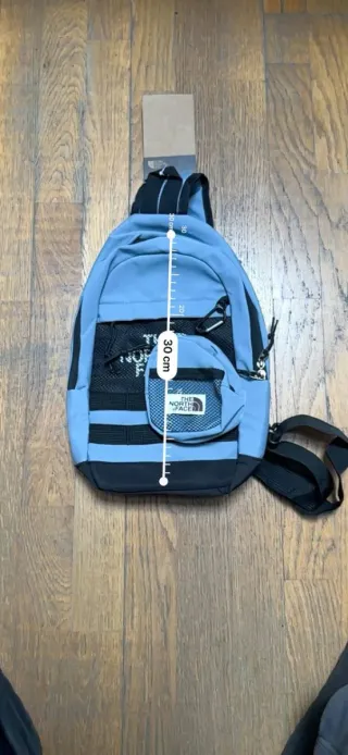 Mochila Sling Bag The North Face Azul y Negro