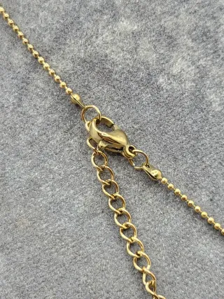 Colgante Géminis Acero Quirúrgico Baño Oro