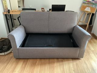 Sofá cama gris de tela