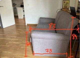 Sofá cama gris de tela