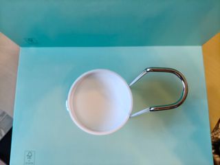 Porta-colher em metal cromado