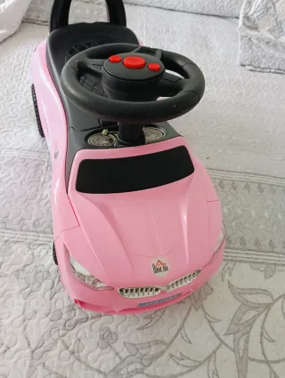 Coche correpasillos rosa con luces y sonidos