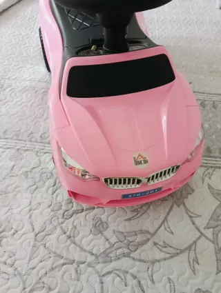 Coche correpasillos rosa con luces y sonidos