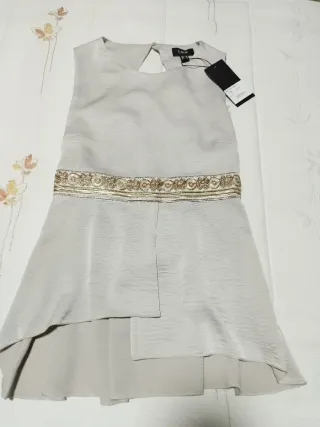 Top fiesta cintura dorada con lazada.