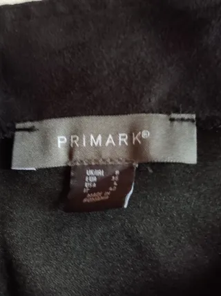 Peto negro con bolsillos