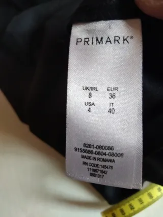 Peto negro con bolsillos