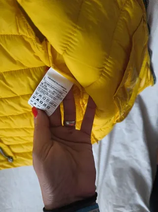 Giubbotto Benetton giallo. Taglia L per bambini