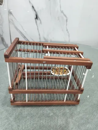 Jaula para pájaros de madera y metal