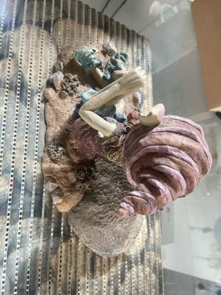 Figura de duende con setas