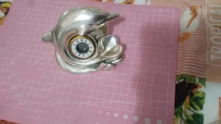 Statuetta delfino in argento