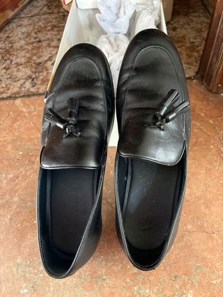 Mocasines de piel negros con borlas