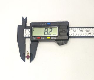 Colgante Cruz de oro 18k con piedra, 0.95 g.