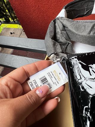 Borsa Michael Kors nera lucida