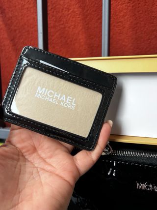 Borsa Michael Kors nera lucida