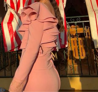 Traje de flamenca rosa con volantes