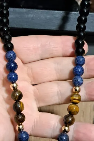 Mala pietre dure nere e blu marroni oro