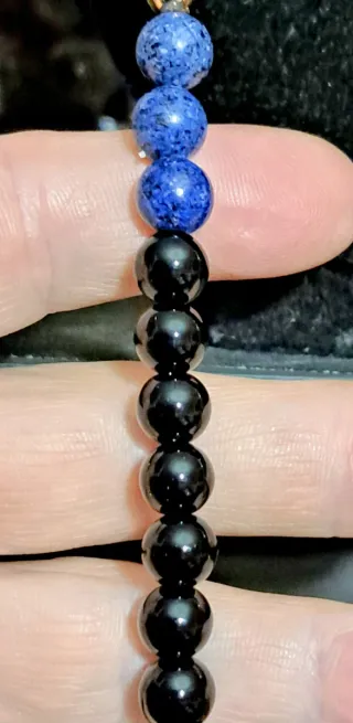 Mala pietre dure nere e blu marroni oro